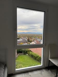 a window in a room with a view at ESER - Haus am Vogesenblick in Bad Bellingen