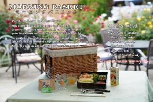 a table with a basket of food on top of it at Hananoyado Yumefuji in Fujikawaguchiko