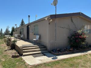 a house with a porch and stairs leading to it at Sunsets and City Lights 3BD 2Bath in Miramonte