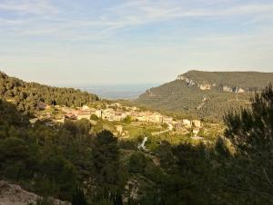 a small village on a hill in the mountains at Cal Pedrellar in Colldejou
