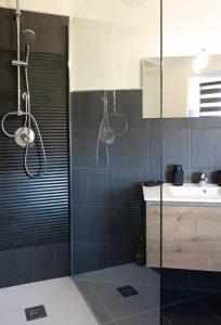 a bathroom with a shower and a sink at alloggio belvedere nel borgo in Gradoli +17 photos