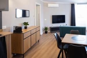 a living room with a kitchen and a dining room at alloggio belvedere nel borgo in Gradoli