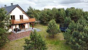 an aerial view of a house with a pool at Strumykowa 3 in Swornegacie