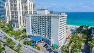 an aerial view of a building at the beach at Renovated Beachfront Condo with Balcony in Sunny Isles Beach
