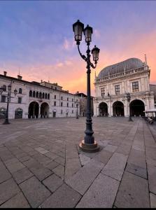 a street light in front of a large building at Hotel Solferino in Brescia