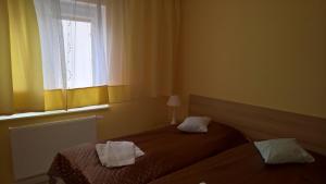 Posteľ alebo postele v izbe v ubytovaní Apartament Posejdon Kołobrzeg