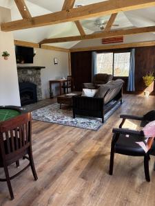 a living room with a couch and a fireplace at Killington/ Rutland 2 bedroom Cabin, cabin #4 in Killington