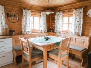 a dining room with a wooden table and chairs at Im Bayerischen Wald in Viechtach