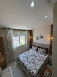 a bedroom with a bed and a window at New Luxury apartment with 3 pool in Cabo Negro +27 photos