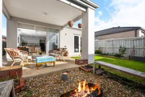a patio with a fire pit in the yard at 3BR Light-filled Retreat Mt Duneed in Mount Duneed