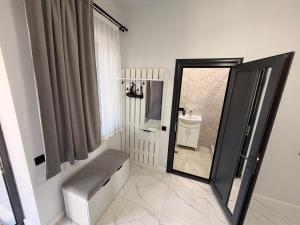 a bathroom with a mirror and a sink and a toilet at MM House in Yerevan +39 photos