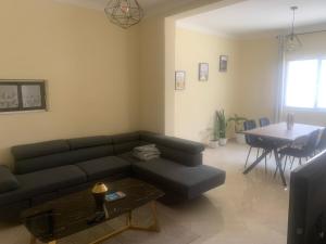 a living room with a couch and a table at Beautiful 2-bedroom apartment in Assomada