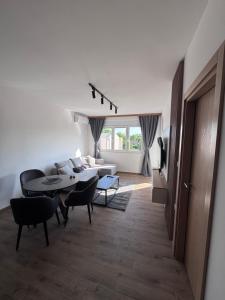 a living room with a couch and a table at Emperus Spa in Veliko Gradište