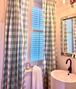 a bathroom with a sink and a window at Plantation House Bed & Breakfast in Port Hope +53 photos