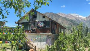 a house with a mural on the side of it at The North Rememberzz in Kalgha
