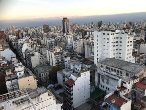 an aerial view of a city with tall buildings at Corrientes Center in Buenos Aires