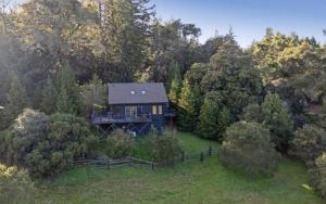 an aerial view of a house in the woods at The Land - Retreat Center In Beautiful Nature - Bay Area Northern California in Philo