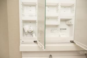 a white refrigerator with a glass door at WANOKAEDE HOTEL New Wing in Tokyo +93 photos