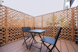 two chairs and a table on a balcony at WANOKAEDE HOTEL New Wing in Tokyo