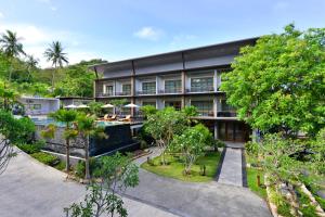 an exterior view of a building with trees at Seacrest Boutique Kohtao Thailand in Ko Tao