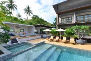 a villa with a swimming pool and a house at Seacrest Boutique Kohtao Thailand in Ko Tao
