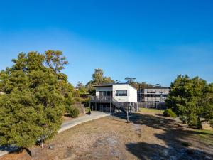 an aerial view of a house with trees at Bay View Escape in Binalong Bay