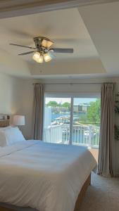 a bedroom with a bed and a large window at WYJEK Stays - Riverside Haven in Cambridge +25 photos