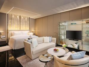 a hotel room with a bed and a living room at J Hotel, Shanghai Tower in Shanghai +80 photos