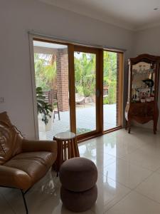 a living room with a couch and a chair at Sunnyhome in Truganina