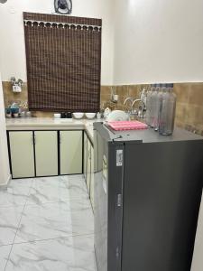 a kitchen with a sink and a counter top at Forest breeze villa in Jalandhar