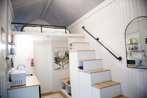 a room with a bunk bed and boxes at Tiny Inja 1 by Tiny Away in Comleroy