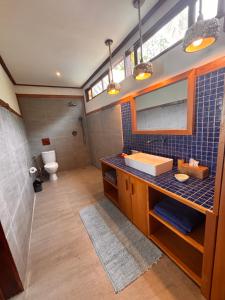 a bathroom with a sink and a toilet at Ombak Biru Resort in Tua Pejat +65 photos