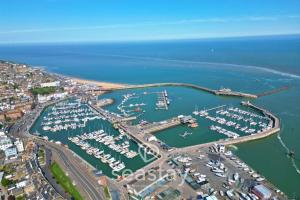 an aerial view of a marina with boats in the water at Beach Lookout Direct Access to Viking Bay Sleeps 4 in Kent +32 photos