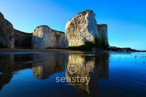 a view of two large rocks in the water at Beach Lookout Direct Access to Viking Bay Sleeps 4 in Kent