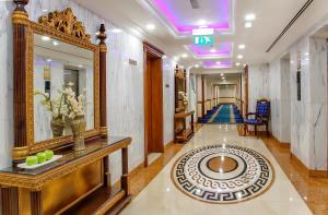 a hallway in a hotel with a mirror and a hallway sidx sidx sidx at Grand Excelsior Hotel - Bur Dubai in Dubai