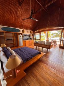 a bedroom with a large bed in a room at Ombak Biru Resort in Tua Pejat