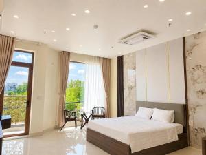 a bedroom with a bed and a balcony at O Lily Hotel in Ninh Binh +26 photos