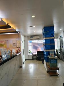 a lobby of a hospital with a counter and boxes at Nice Hotel Aurora Cubao in Manila