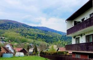 a house with a view of a mountain at Studio 2-pokojowe z balkonem z widokiem na góry in Międzybrodzie Żywieckie +12 photos