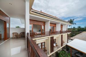 an image of a balcony of a house at The Pulau Bungalow in Nusa Lembongan