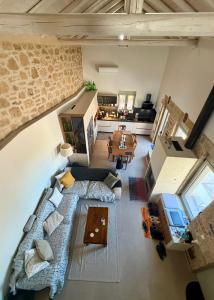 an overhead view of a living room and dining room at ALONI retreat in Proástion