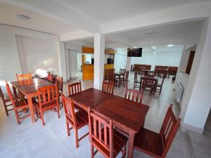 a dining room with wooden tables and chairs at Virginia hotel in La Quiaca