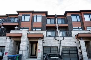 a building with a car parked in front of it at Hiltons Villa in Brampton