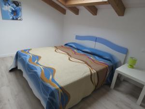 Giường trong phòng chung tại Affittacamere Maria Stella