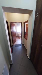 a hallway with a door leading to a bathroom at Room 2 in Gotse Delchev