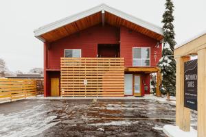 a red building with a sign in front of it at Mt Jackson Suite Boutique Hotel Hospitality in Kalispell