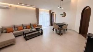 a living room with a couch and a table at Koh Rong New Beach Resort in Koh Rong Island