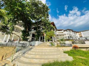 a set of stairs in front of some buildings at Hotel Elephant Bay - World's Best Place to See the Elephants in Pinnawala