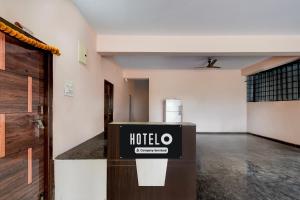 a hotel room with a sign in the middle of a room at Super Hotel O Bharat Institute of Engineering Hyderabad Formerly Blue Petals in Hyderabad