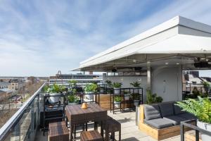 an outdoor patio with a table and chairs at Original Sokos Hotel Vaakuna Vaasa in Vaasa